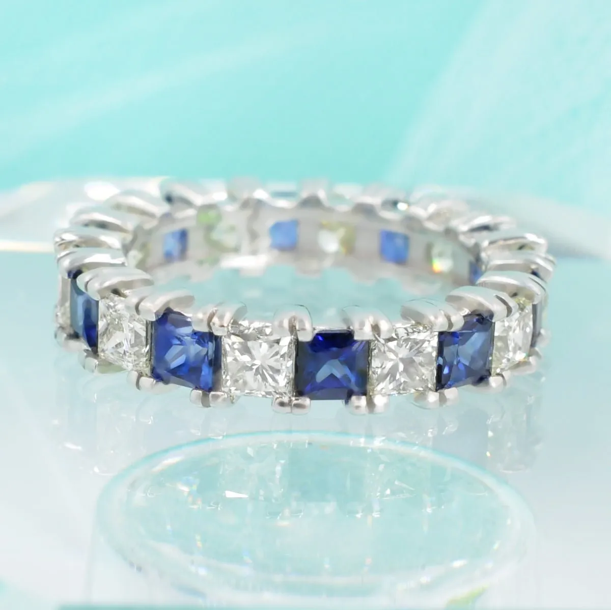 Exquisite 4.70CT Princess cut Diamonds and Blue Sapphires Eternity Ring in 18KT White Gold