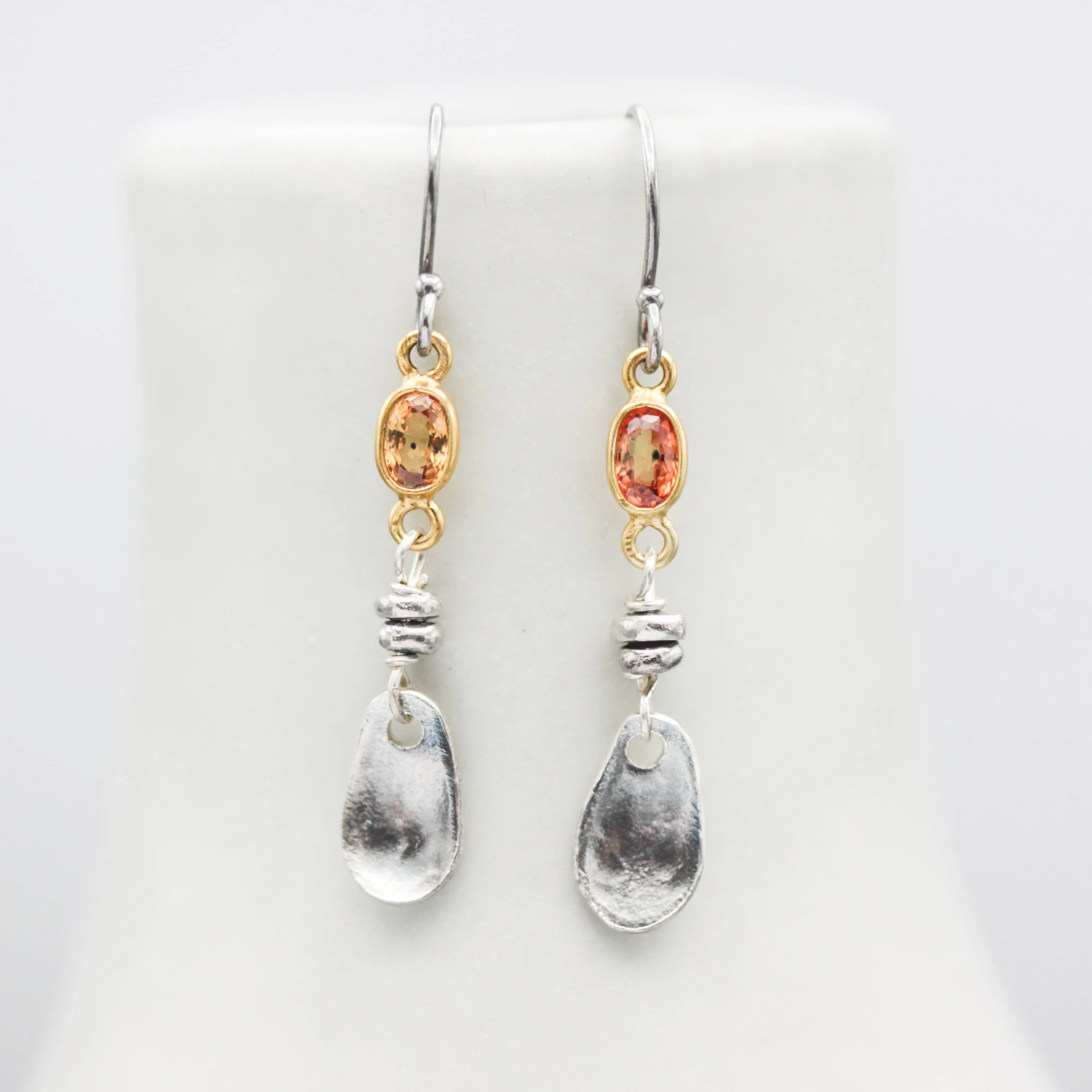 Orange sapphire earrings in bezel setting with silver leaf on sterling silver hooks style