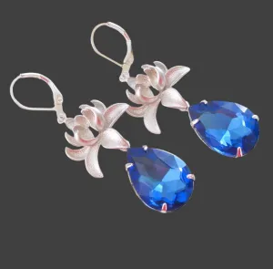 Silver Orchid And Sapphire Faceted Teardrop Crystal Earrings.